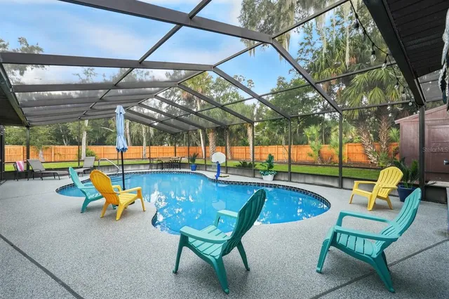 a living room with furniture a couch and a flat screen tv