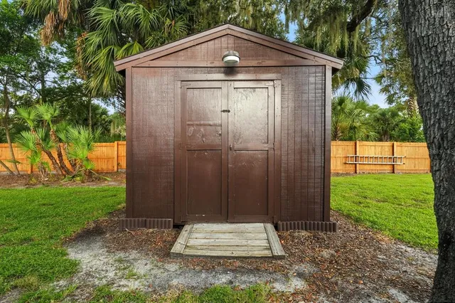 a front view of a house with a yard table and chairs