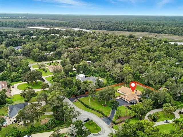 a view of a garden with a house in the background