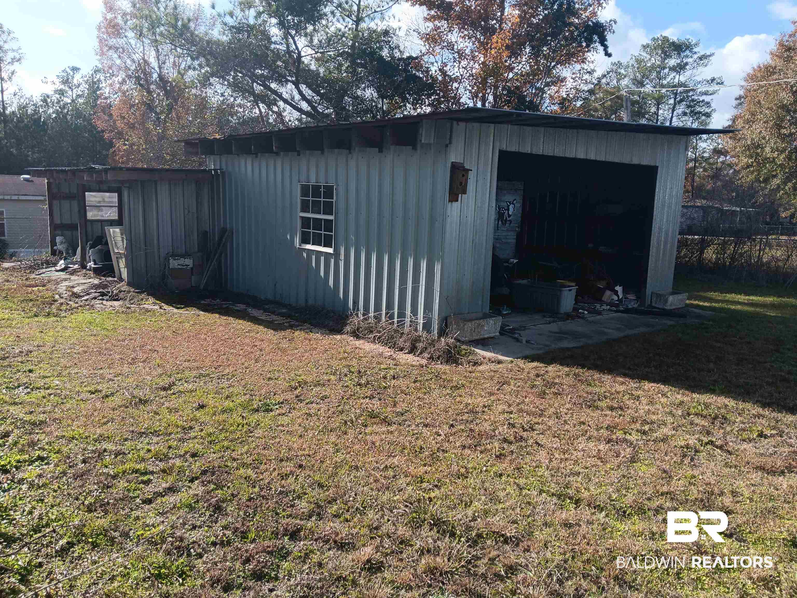 61 Katherine Street Flomaton, AL 36441 - Photo 11 of 13 View of outdoor structure with a lawn