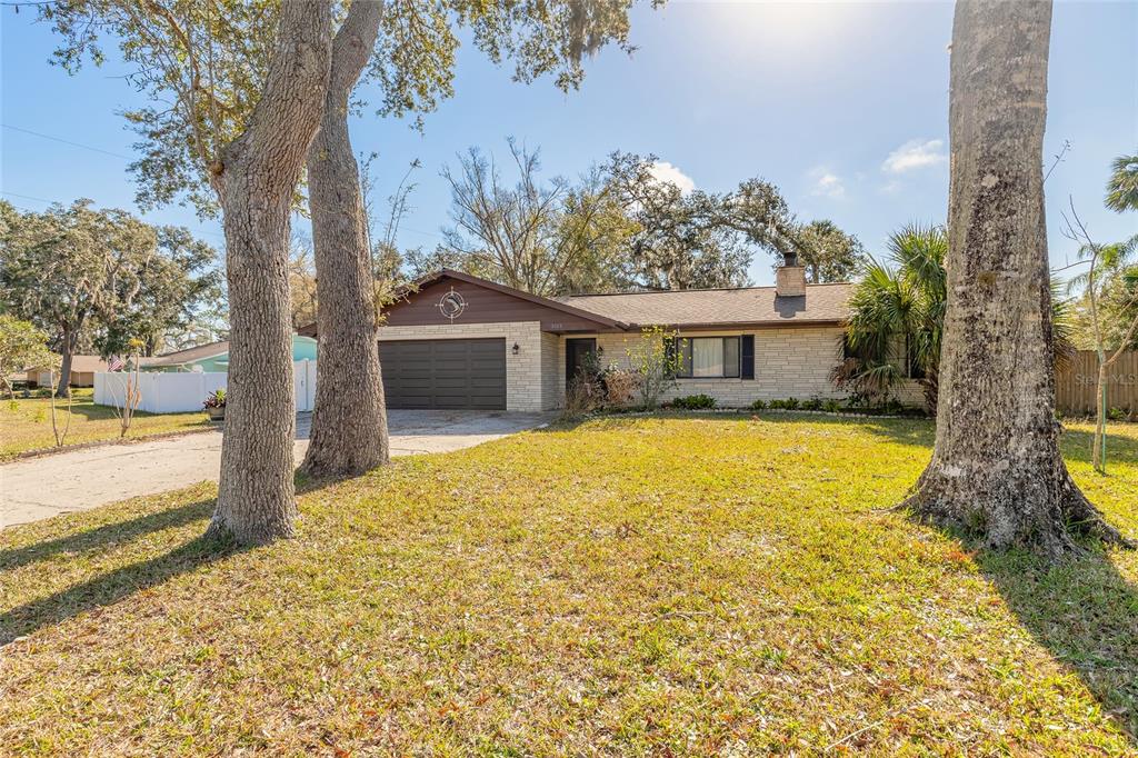 3003 Tamarind Drive Edgewater, FL 32141 - Photo 1 of 1 a house view with a garden space