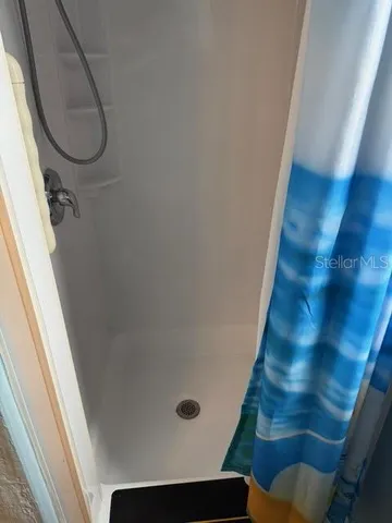 a backyard of a house with fountain and outdoor seating