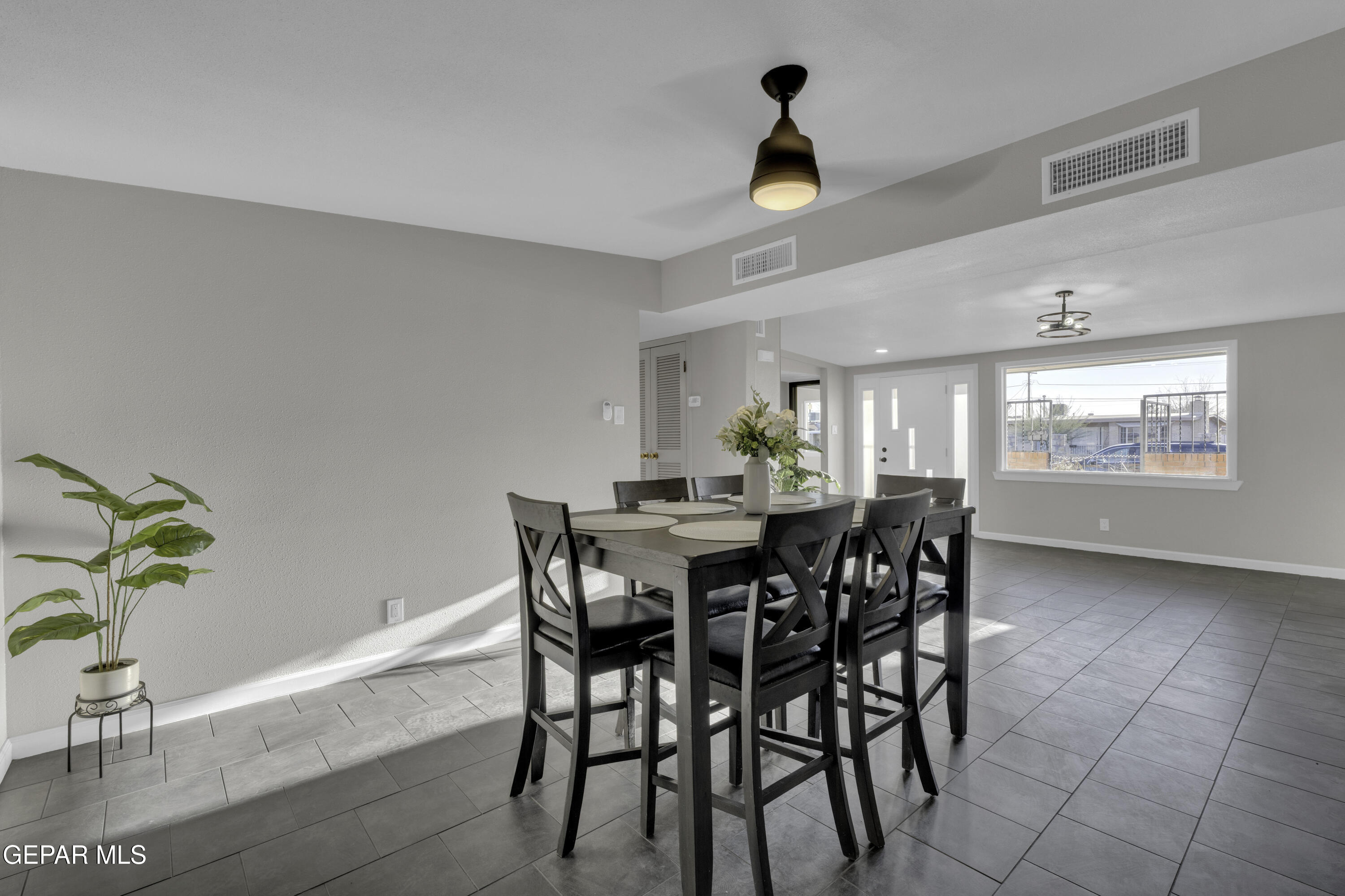 7125 Banana Tree Lane El Paso, TX 79915 - Photo 22 of 62 a view of a dining room with furniture and a potted plant