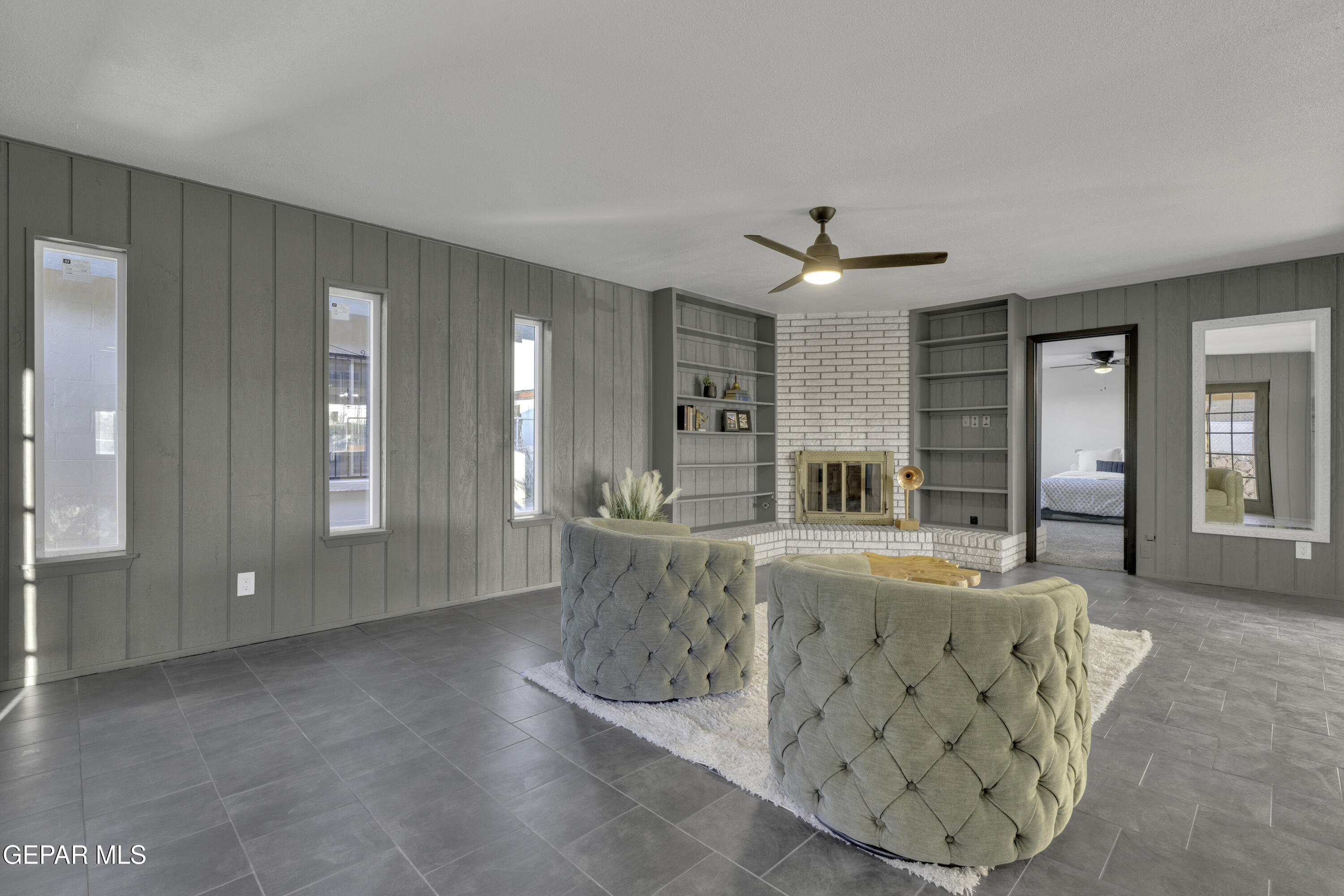 7125 Banana Tree Lane El Paso, TX 79915 - Photo 33 of 62 a living room with furniture and a chandelier