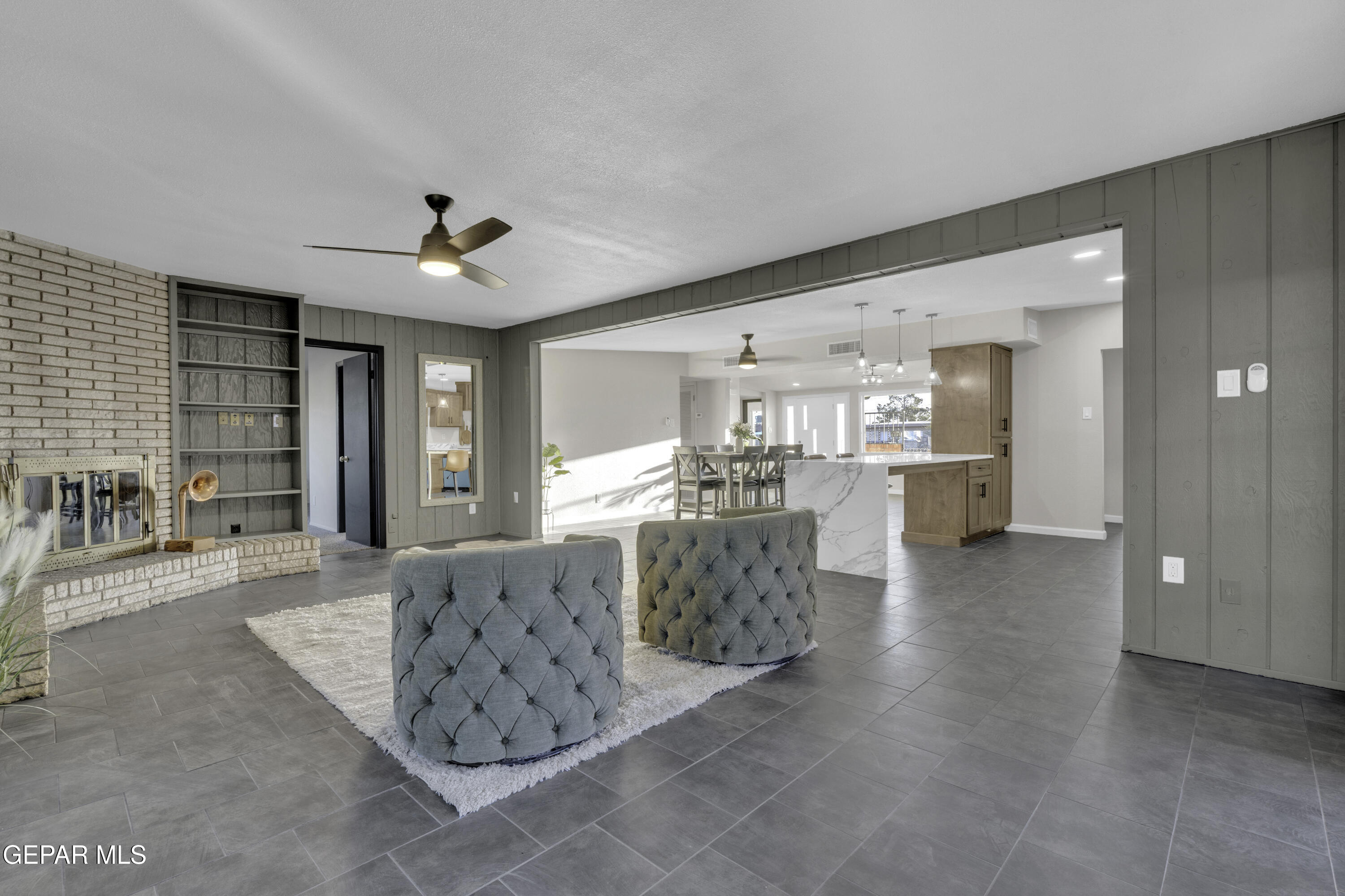 7125 Banana Tree Lane El Paso, TX 79915 - Photo 34 of 62 a living room with furniture and a chandelier