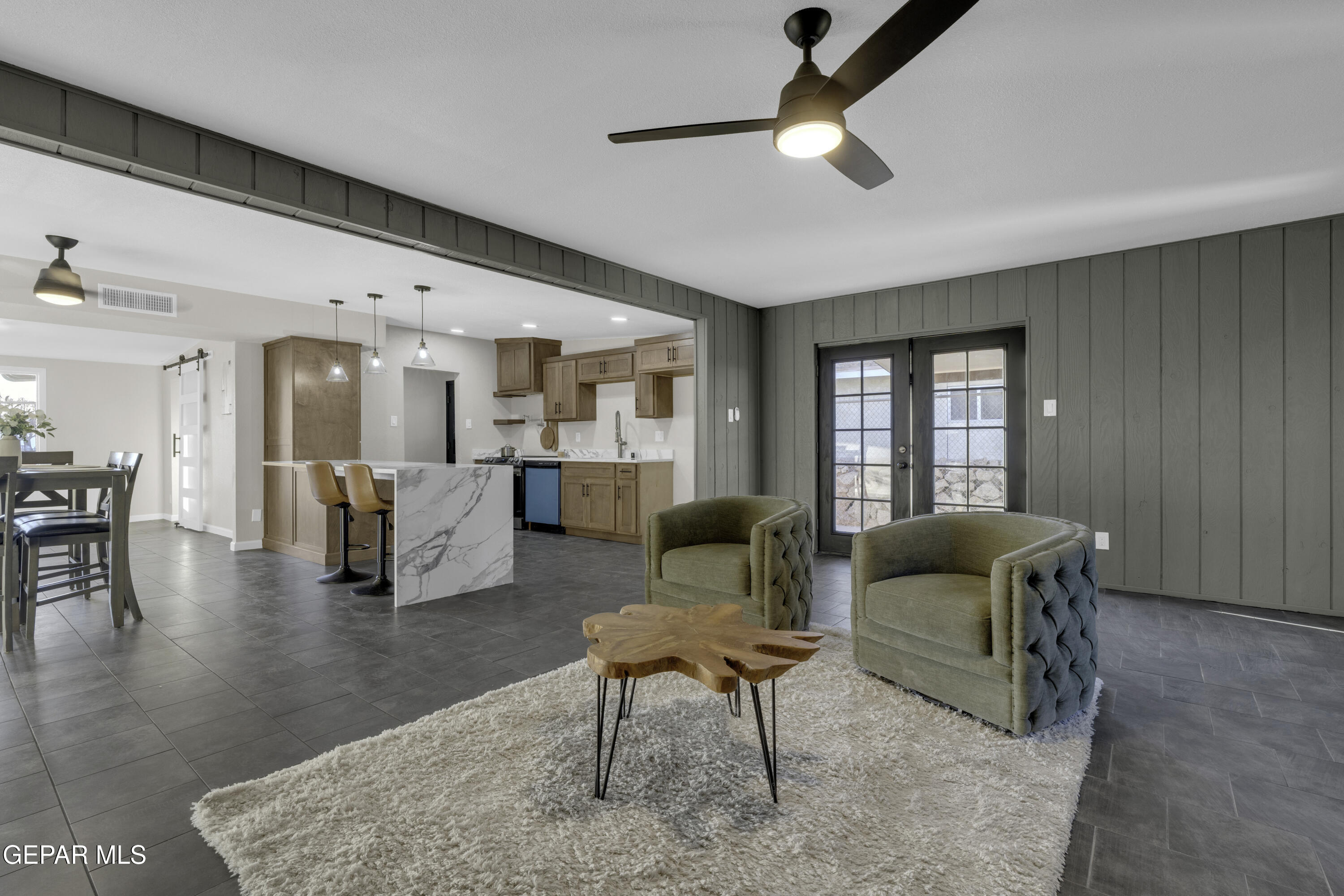 7125 Banana Tree Lane El Paso, TX 79915 - Photo 35 of 62 a living room with furniture and a chandelier