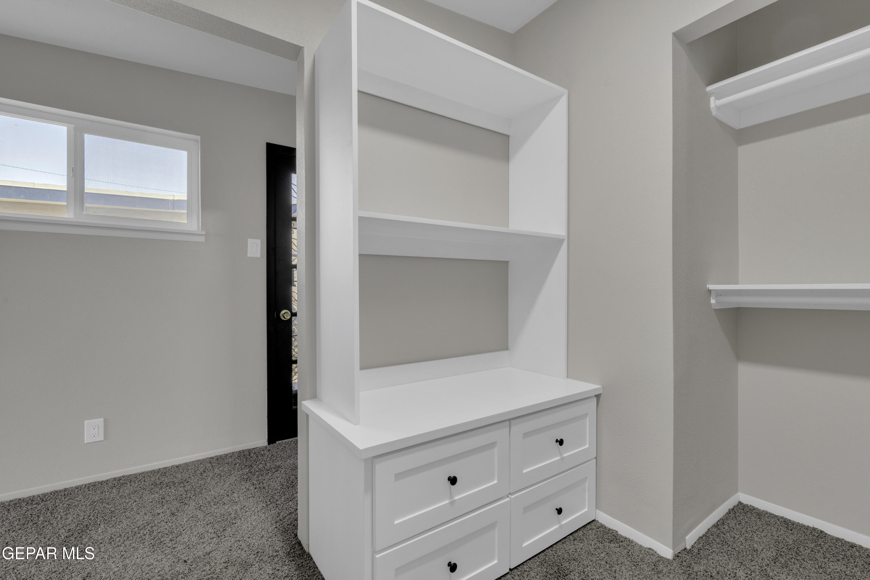 7125 Banana Tree Lane El Paso, TX 79915 - Photo 45 of 62 a room with white cabinets and white doors