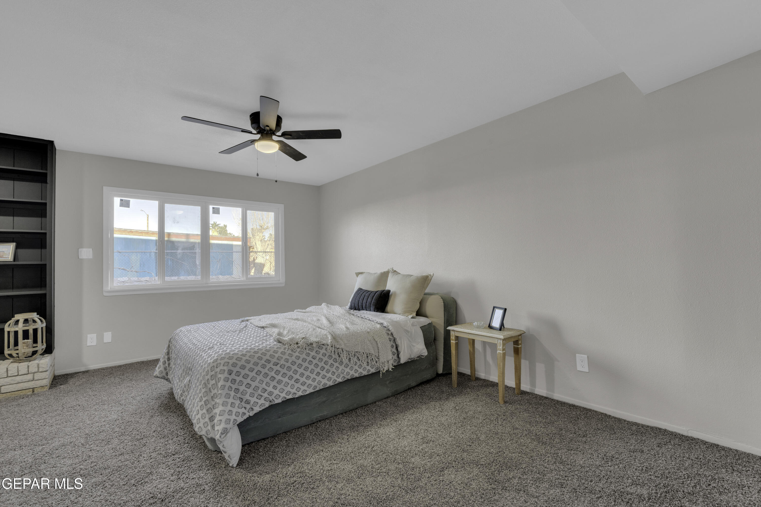 7125 Banana Tree Lane El Paso, TX 79915 - Photo 46 of 62 a bedroom with a bed chandelier and a window