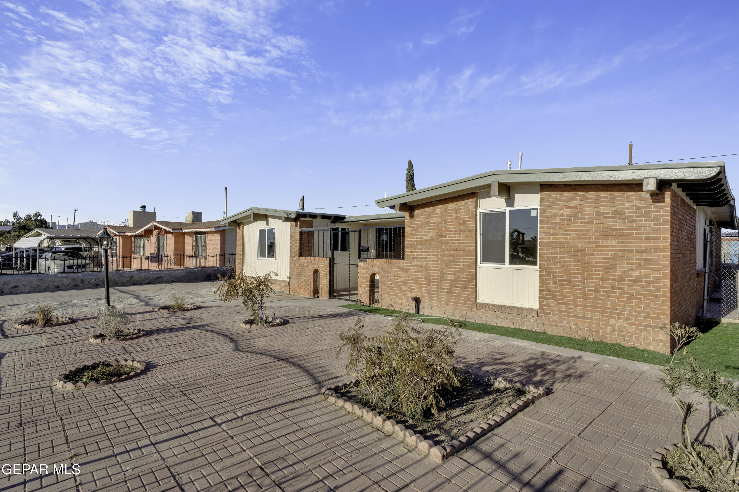 7125 Banana Tree Lane El Paso, TX 79915 - Photo 5 of 62 a front view of a house with a yard