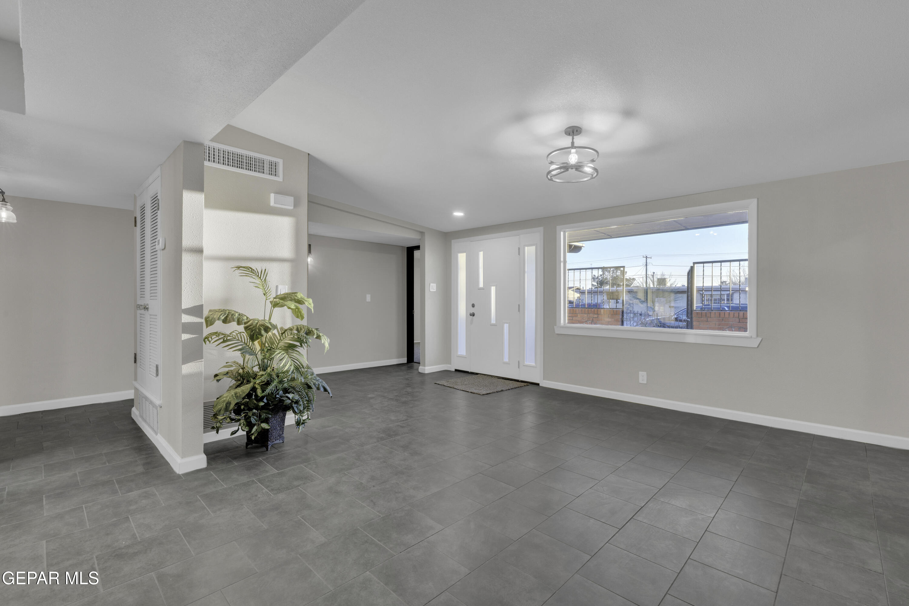 7125 Banana Tree Lane El Paso, TX 79915 - Photo 9 of 62 a view of an empty room with a window