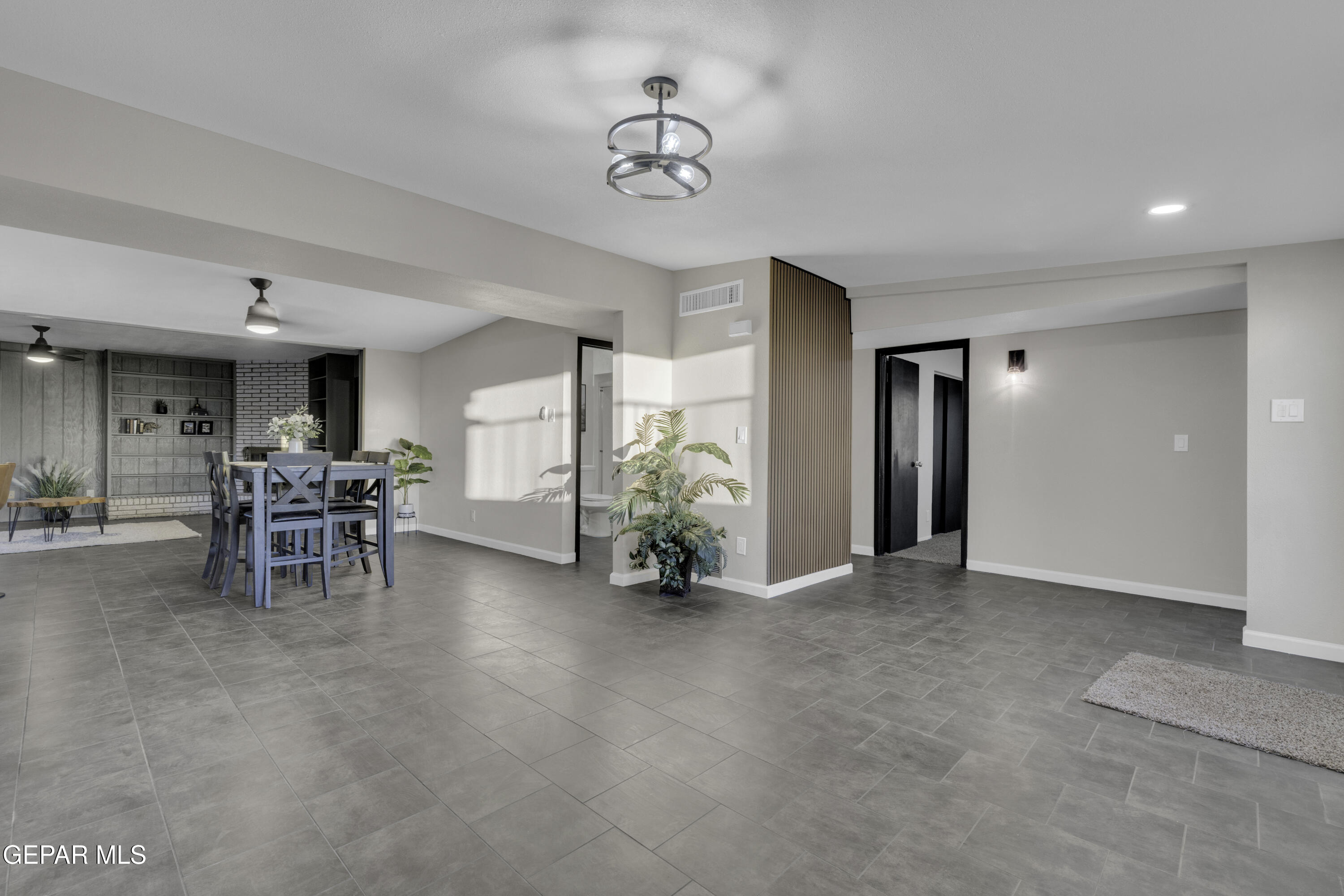 7125 Banana Tree Lane El Paso, TX 79915 - Photo 10 of 62 a view of a livingroom with furniture and a chandelier