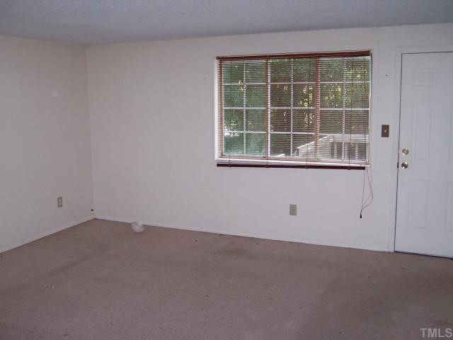 7701 Sandra Lane Raleigh, NC 27615 - Photo 3 of 4 an empty room with a window