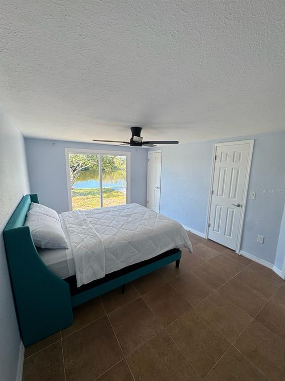 3631 Grayton Drive New Port Richey, FL 34652 - Photo 22 of 42 a bedroom with a bed and a closet