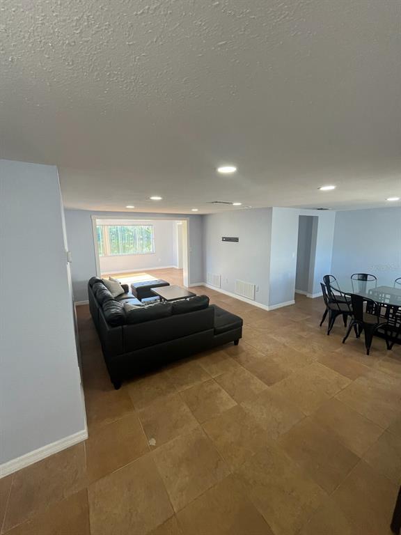 3631 Grayton Drive New Port Richey, FL 34652 - Photo 5 of 42 a living room with furniture and a table