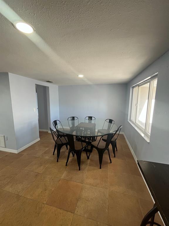 3631 Grayton Drive New Port Richey, FL 34652 - Photo 6 of 42 a view of a big room with furniture and window