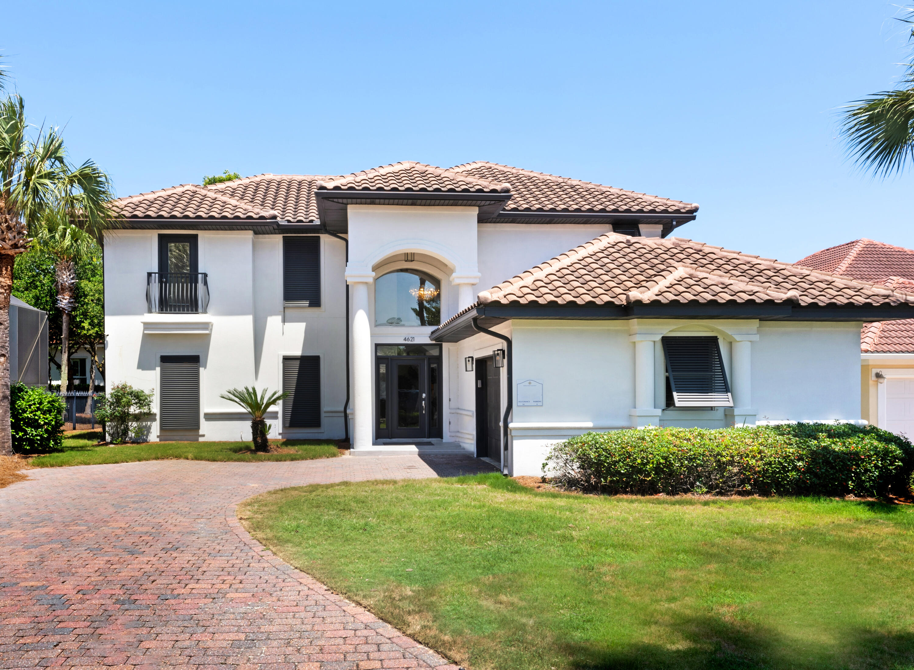4621 Paradise Isle Destin, FL 32541 - Photo 1 of 65 a front view of a house with a garden