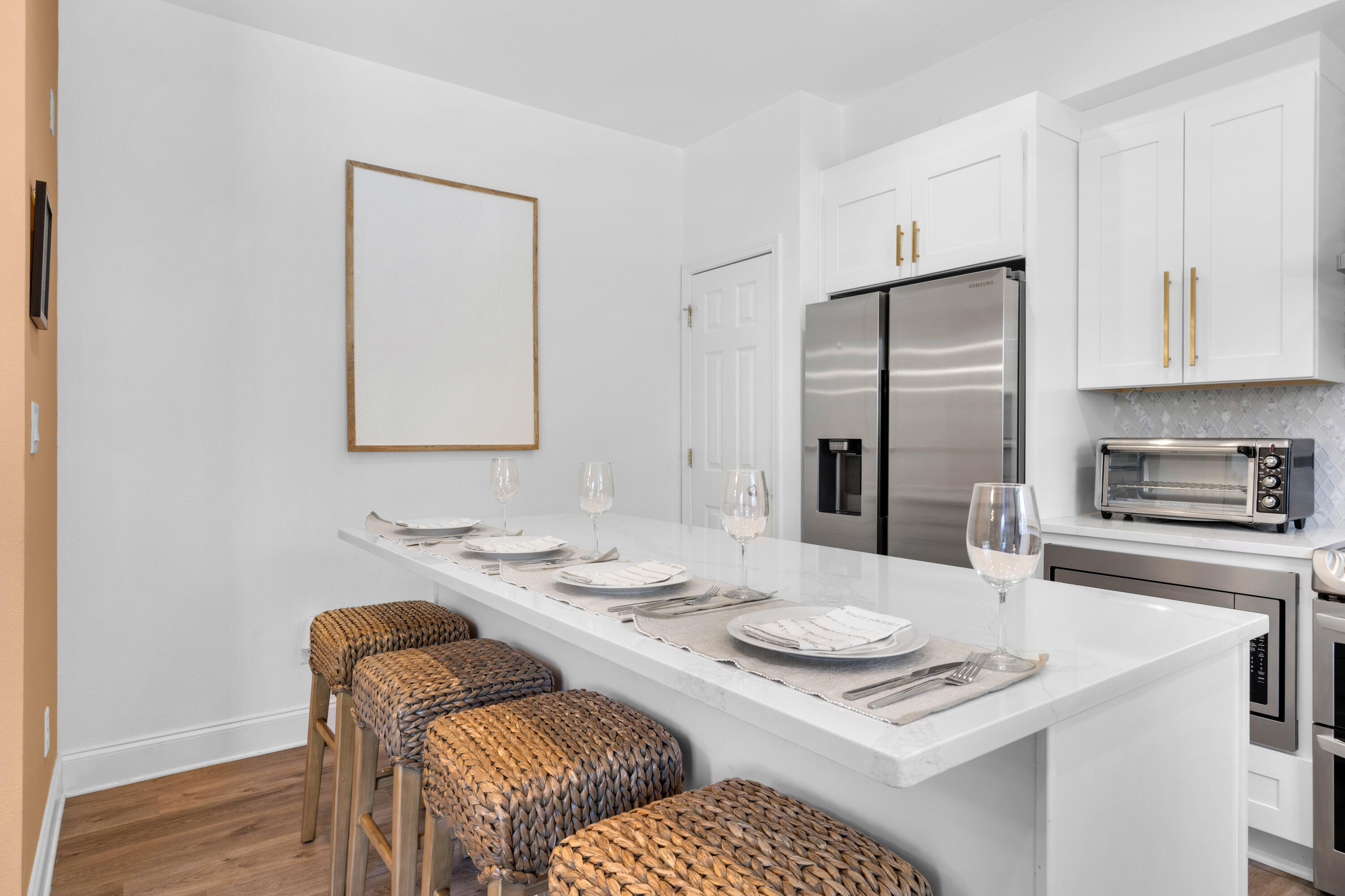 4621 Paradise Isle Destin, FL 32541 - Photo 11 of 65 a kitchen with a table chairs stove and refrigerator