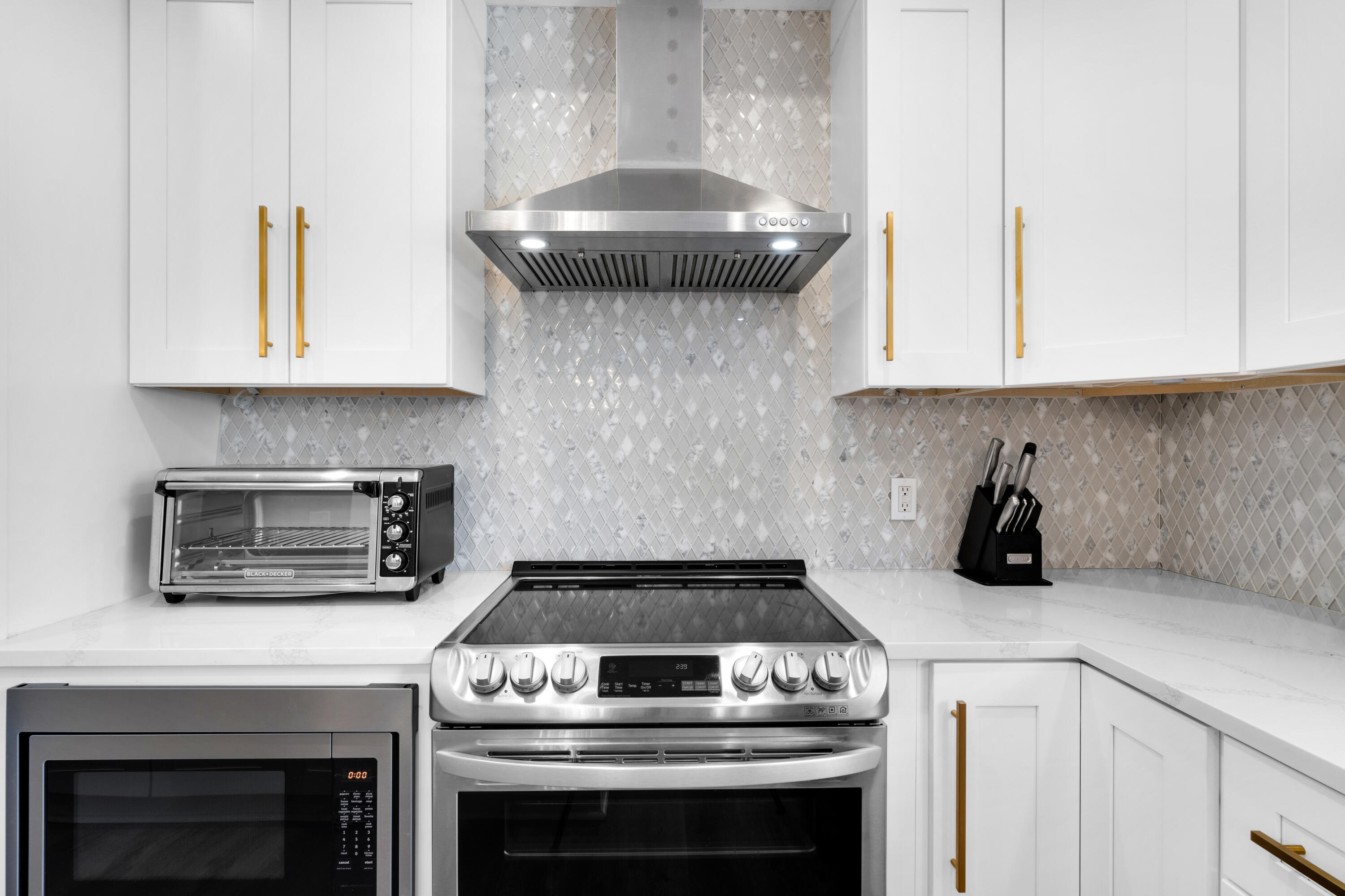 4621 Paradise Isle Destin, FL 32541 - Photo 13 of 65 a kitchen with a stove and a microwave