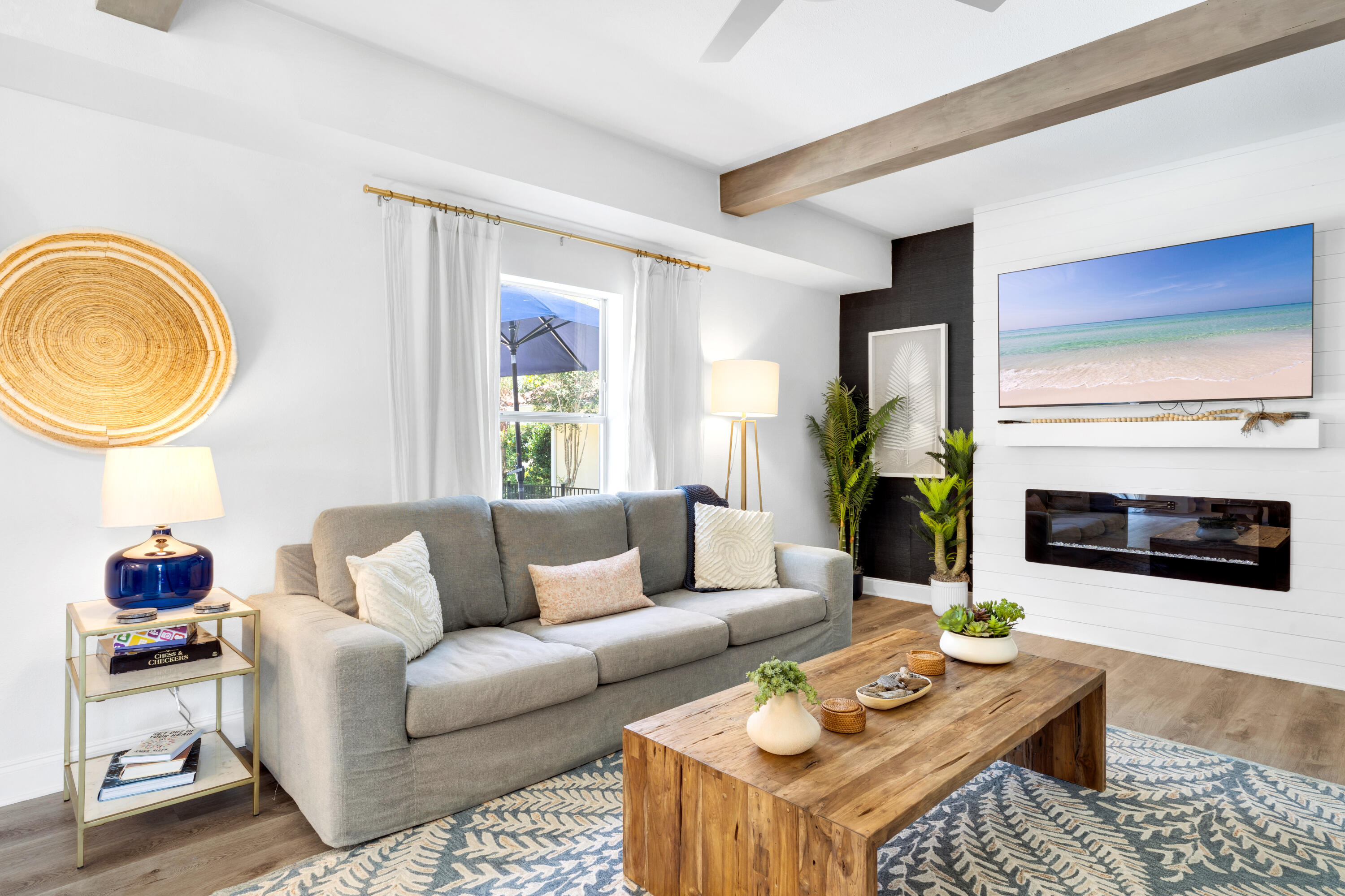 4621 Paradise Isle Destin, FL 32541 - Photo 17 of 65 a living room with furniture a fireplace and a window