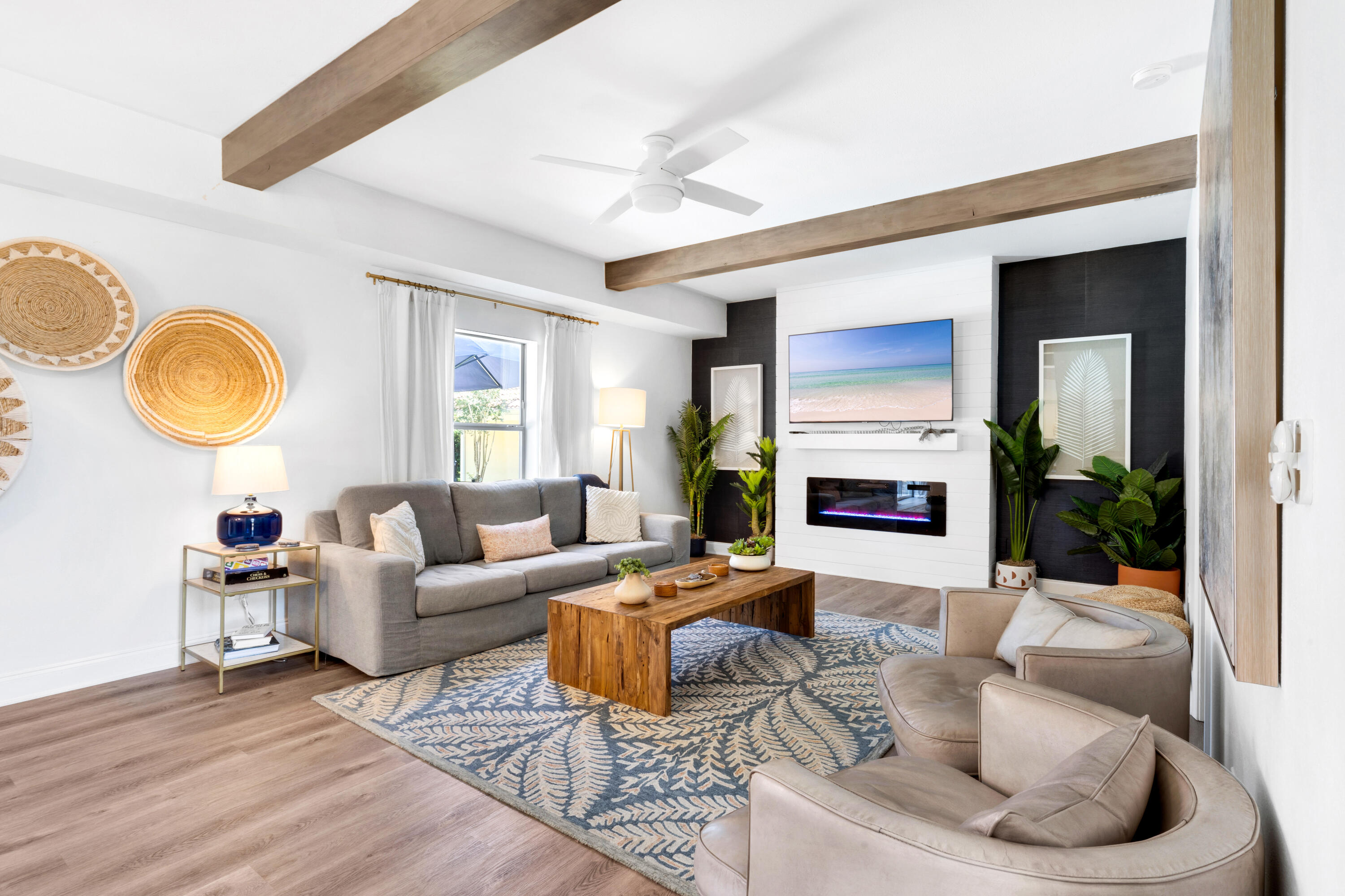 4621 Paradise Isle Destin, FL 32541 - Photo 18 of 65 a living room with fireplace furniture and a large window