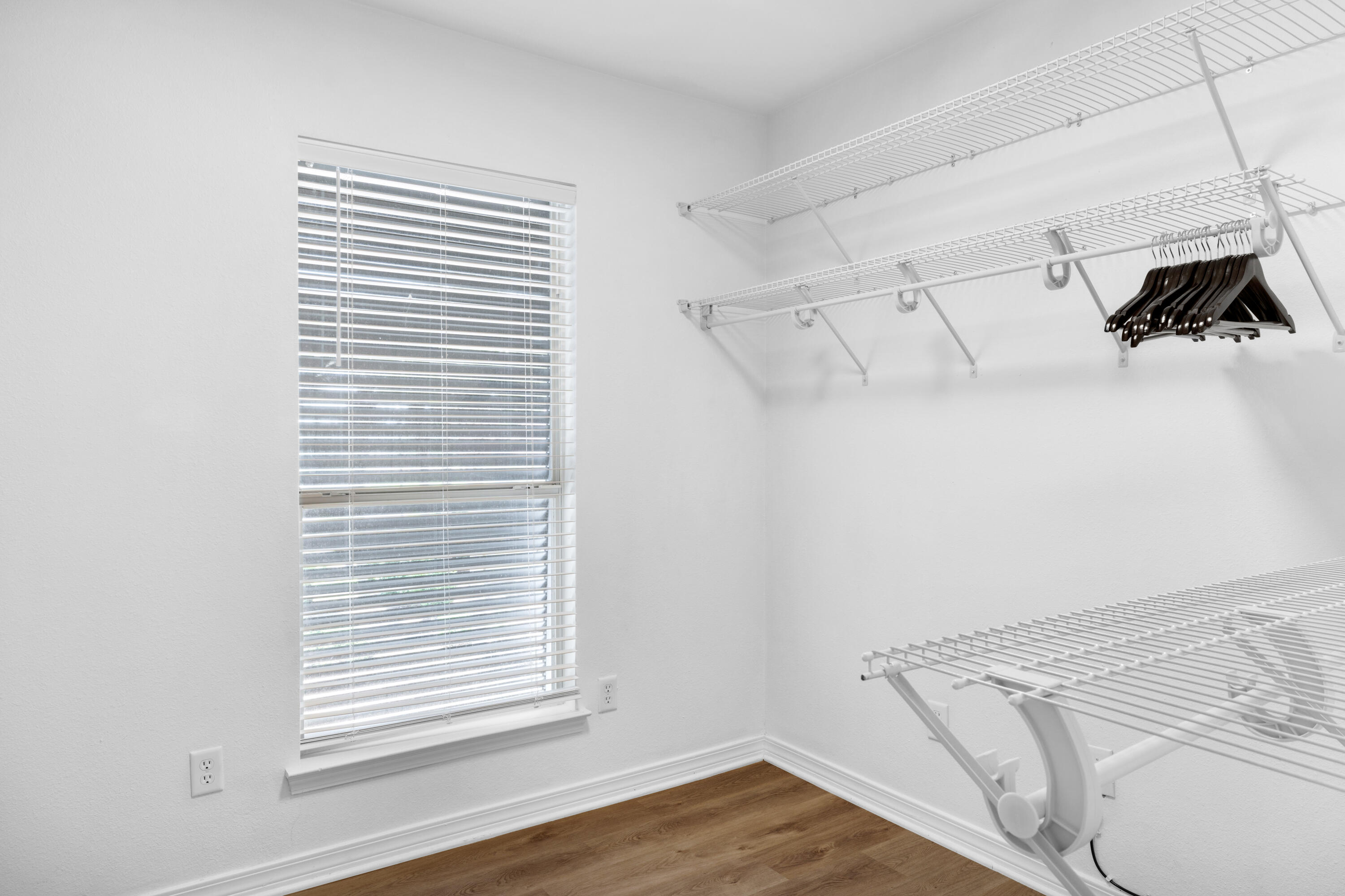 4621 Paradise Isle Destin, FL 32541 - Photo 37 of 65 a view of walk in closet with clothes and shoes