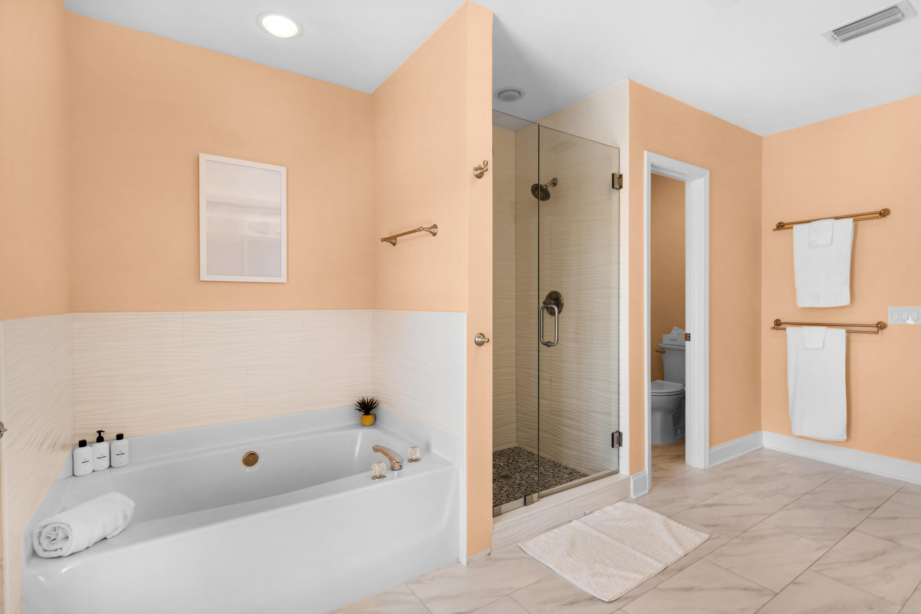 4621 Paradise Isle Destin, FL 32541 - Photo 39 of 65 a bathroom with a bathtub and a shower