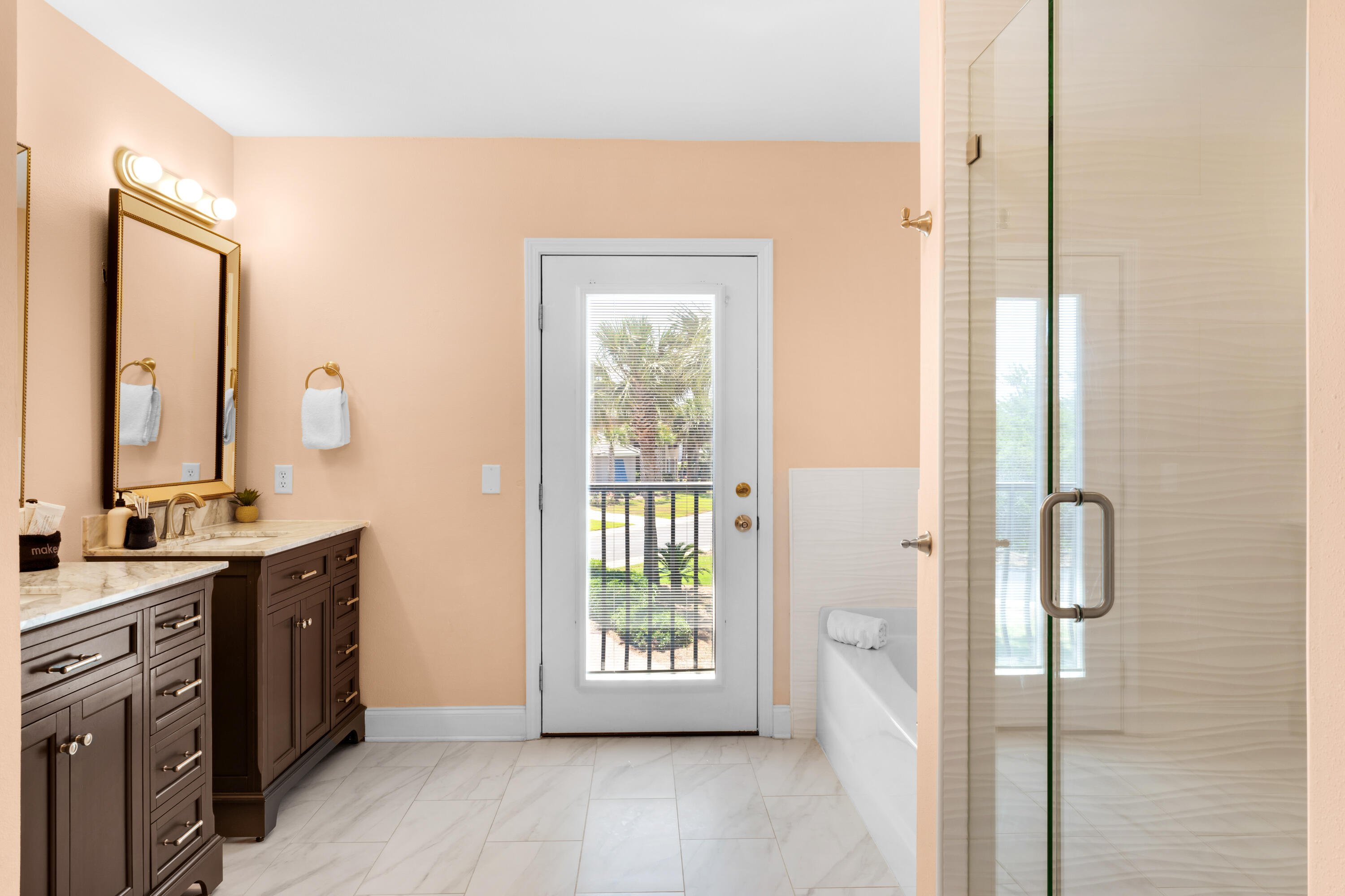 4621 Paradise Isle Destin, FL 32541 - Photo 40 of 65 a view of a bathroom with a sink and a mirror
