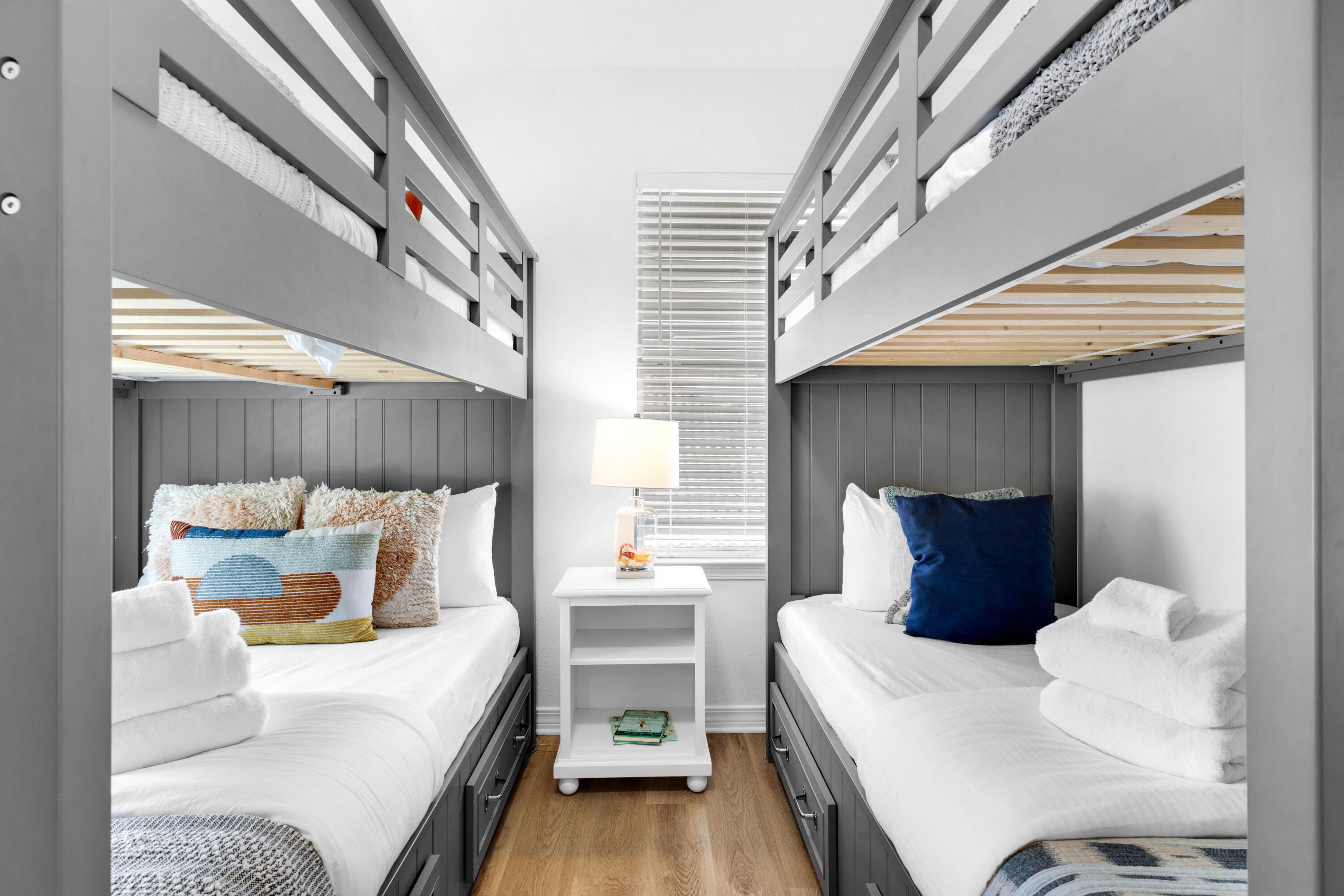 4621 Paradise Isle Destin, FL 32541 - Photo 41 of 65 a bedroom with a bed a mirror and a night stand