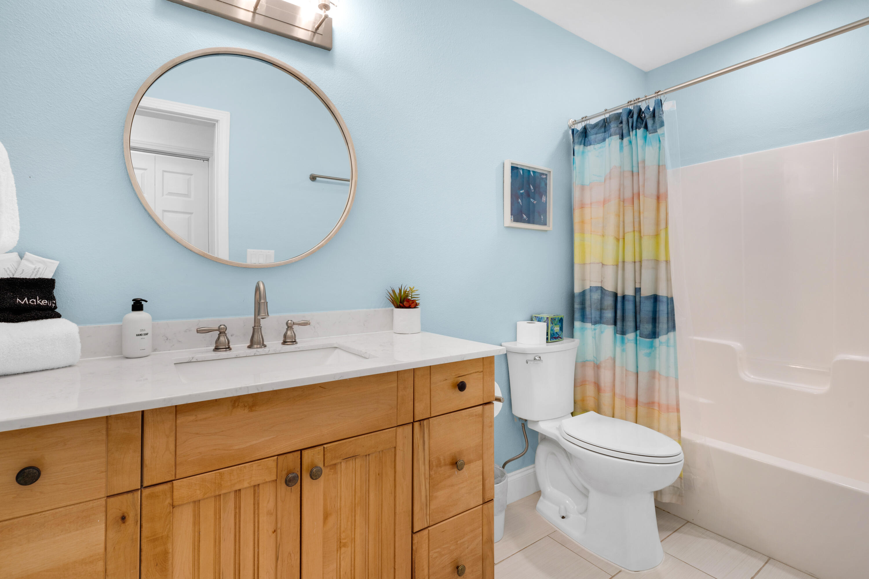 4621 Paradise Isle Destin, FL 32541 - Photo 43 of 65 a bathroom with a sink a toilet and shower