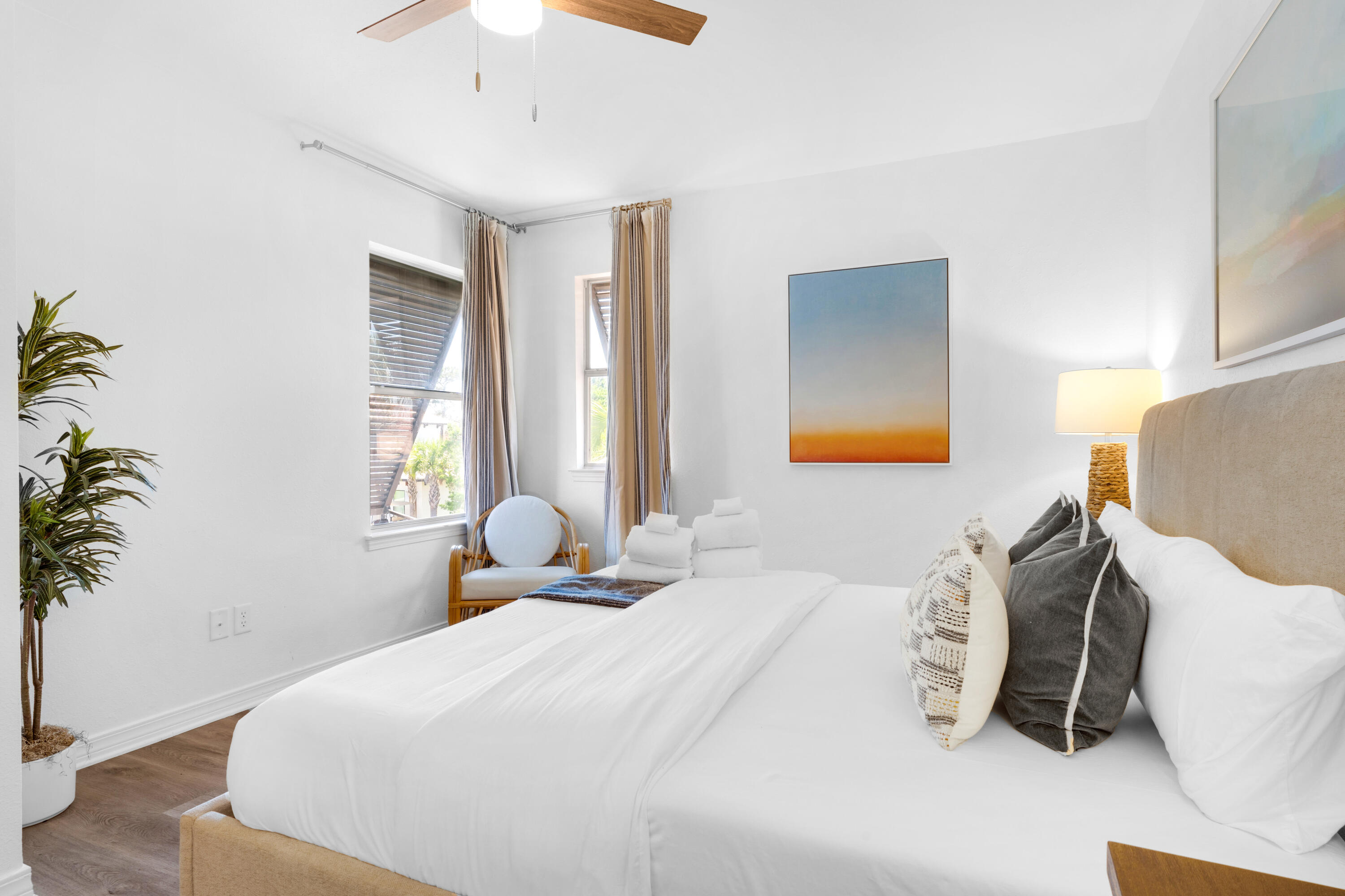 4621 Paradise Isle Destin, FL 32541 - Photo 46 of 65 a bedroom with a bed and a potted plant