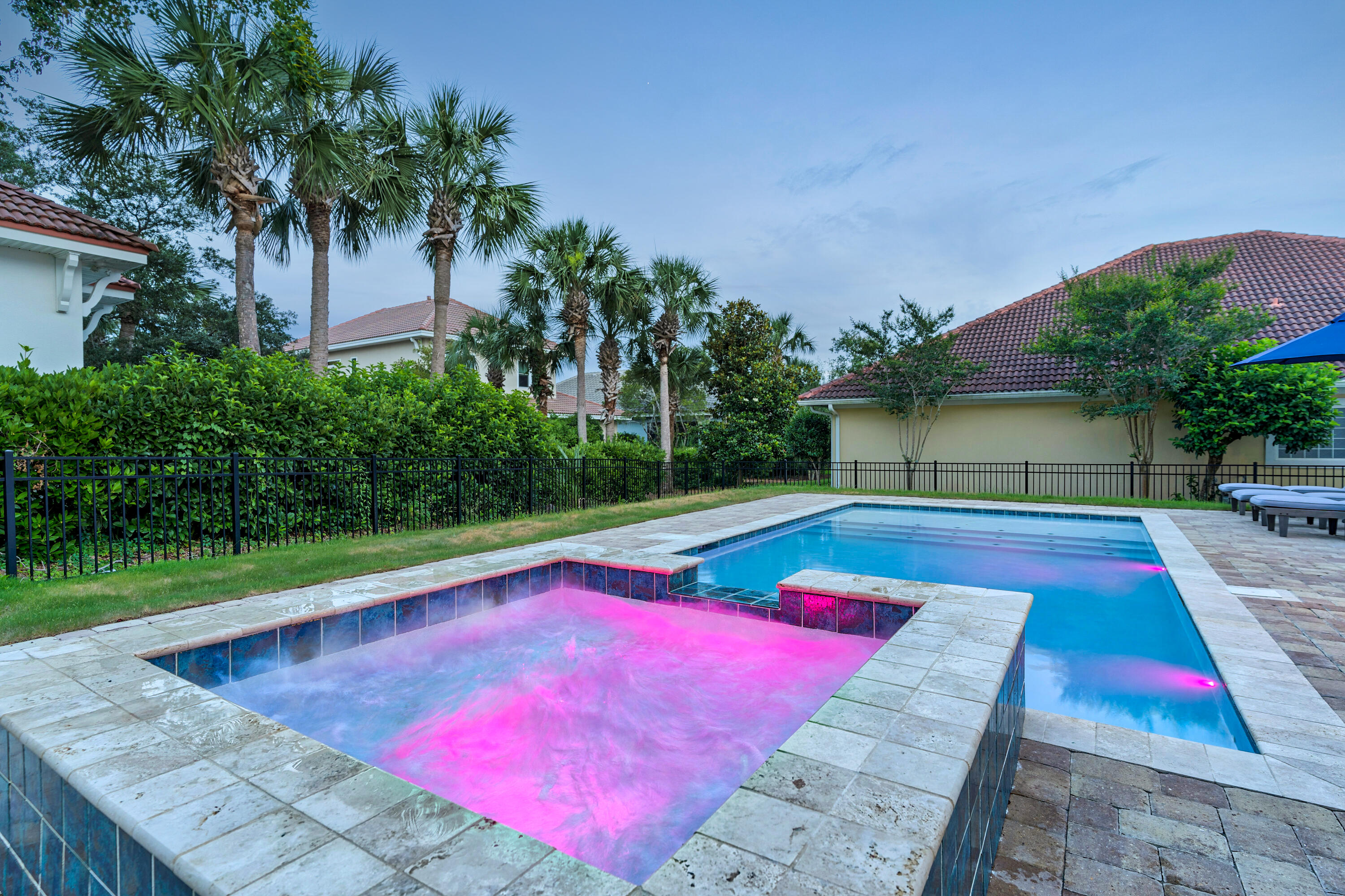 4621 Paradise Isle Destin, FL 32541 - Photo 5 of 65 a view of swimming pool with red chairs