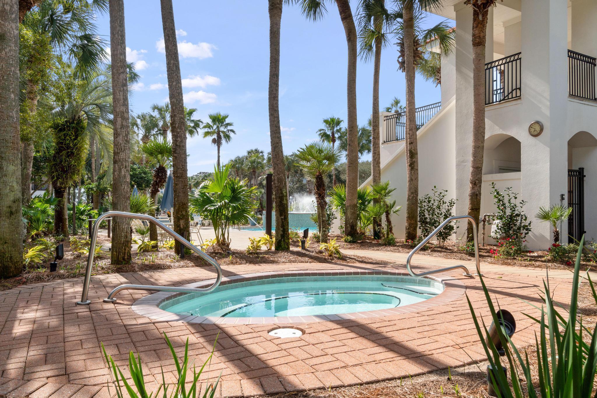 4621 Paradise Isle Destin, FL 32541 - Photo 53 of 65 a view of a swimming pool with a lounge chairs