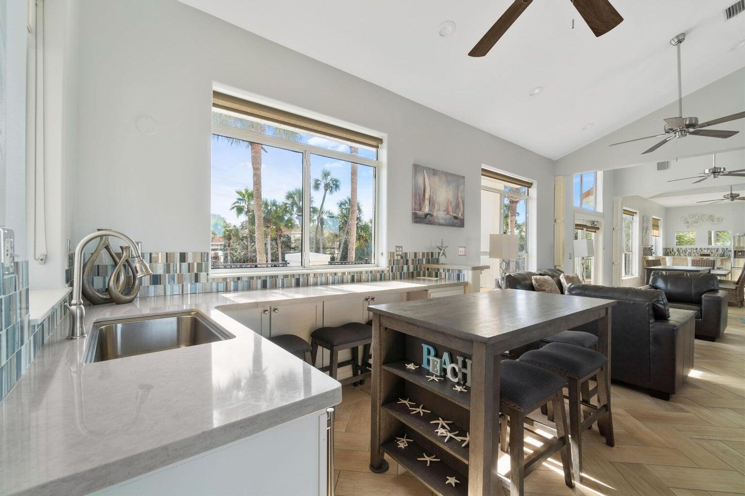 4621 Paradise Isle Destin, FL 32541 - Photo 63 of 65 a open kitchen with a stove and a sink