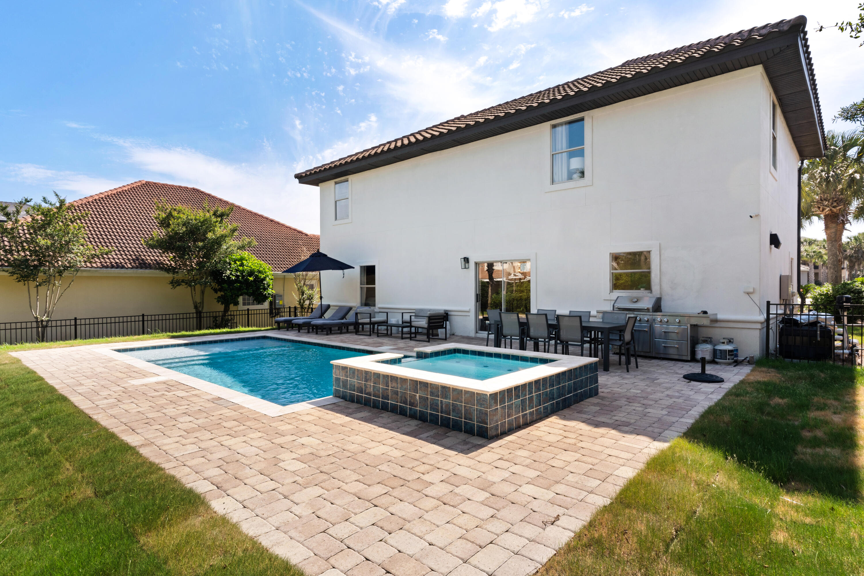 4621 Paradise Isle Destin, FL 32541 - Photo 8 of 65 a view of a patio with swimming pool table and chairs