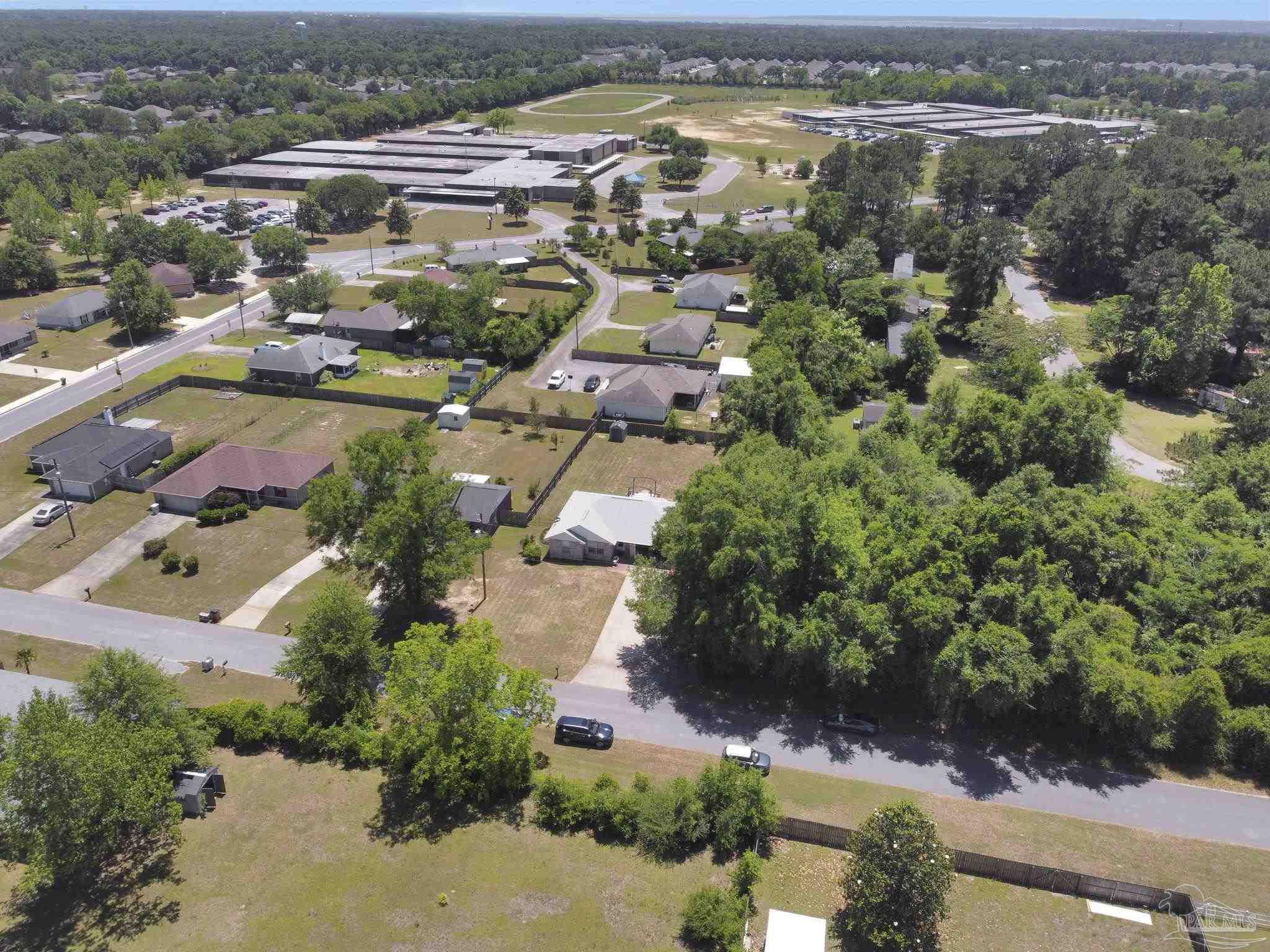 5539 Windrun Place Pace, FL 32571 - Photo 56 of 62 an aerial view of a city with lots of residential buildings
