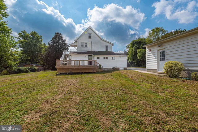 a living room with flat screen tv and a fireplace