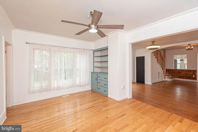 a bathroom with a granite countertop sink toilet and mirror