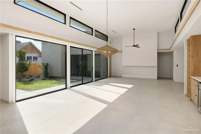 a view of kitchen with refrigerator and oven