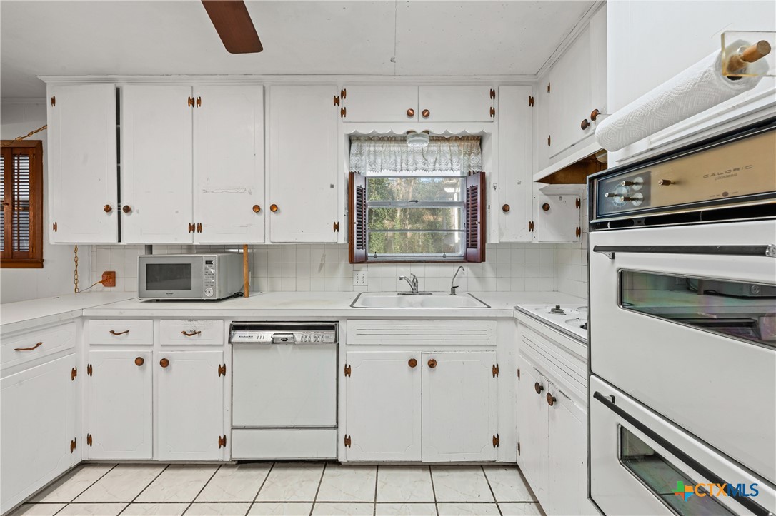 3114 Pecan Drive Temple, TX 76502 - Photo 15 of 32 a kitchen with appliances cabinets and a sink