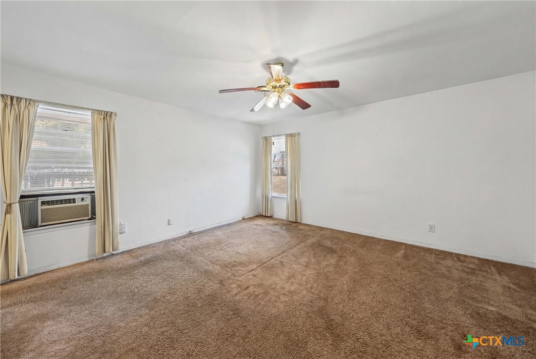3114 Pecan Drive Temple, TX 76502 - Photo 22 of 32 a view of a kitchen with a stove and a refrigerator