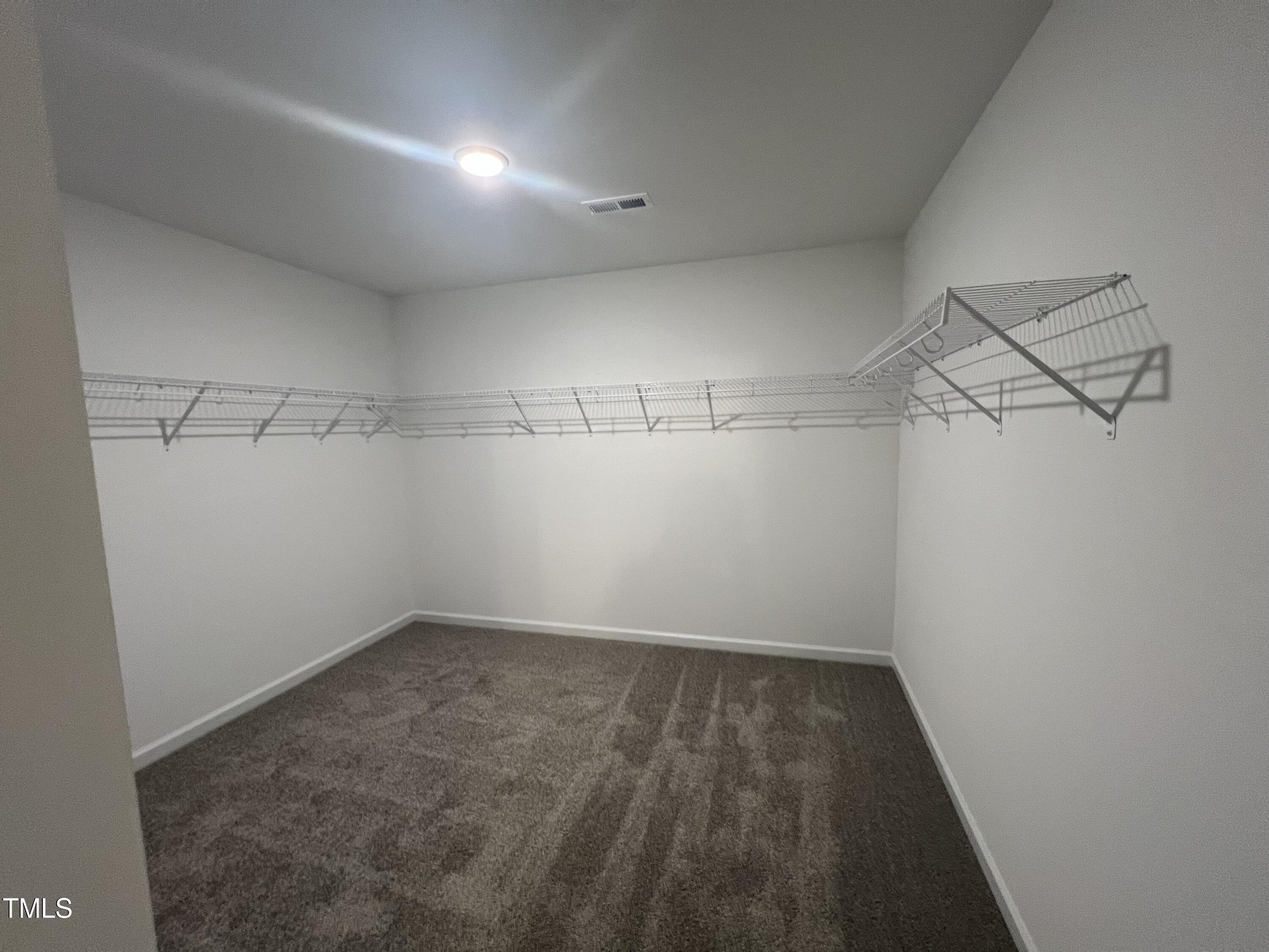 259 Palomo Place Raeford, NC 28376 - Photo 16 of 23 a view of a room with racks on the wall