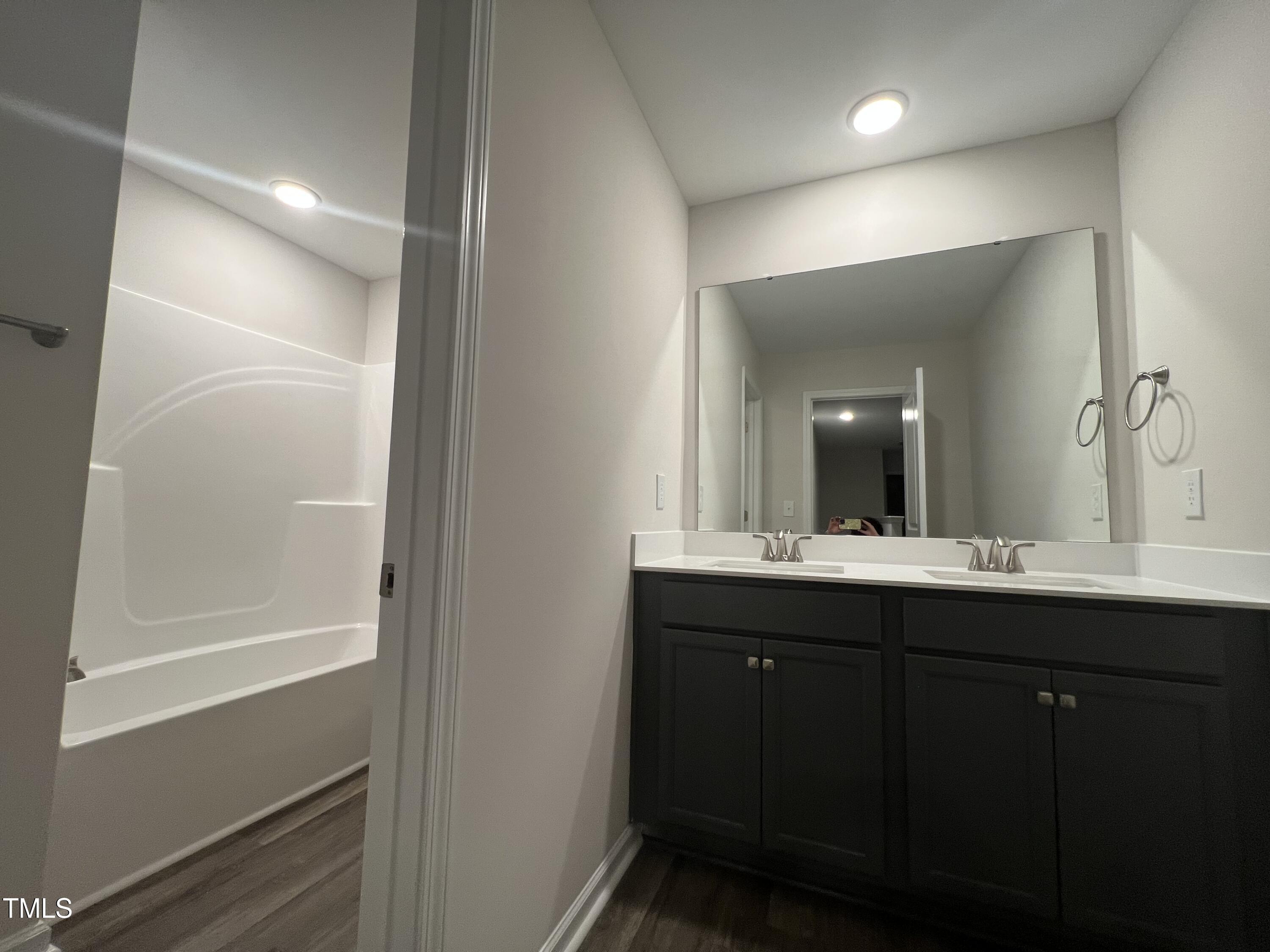 259 Palomo Place Raeford, NC 28376 - Photo 19 of 23 a bathroom with a sink and a mirror