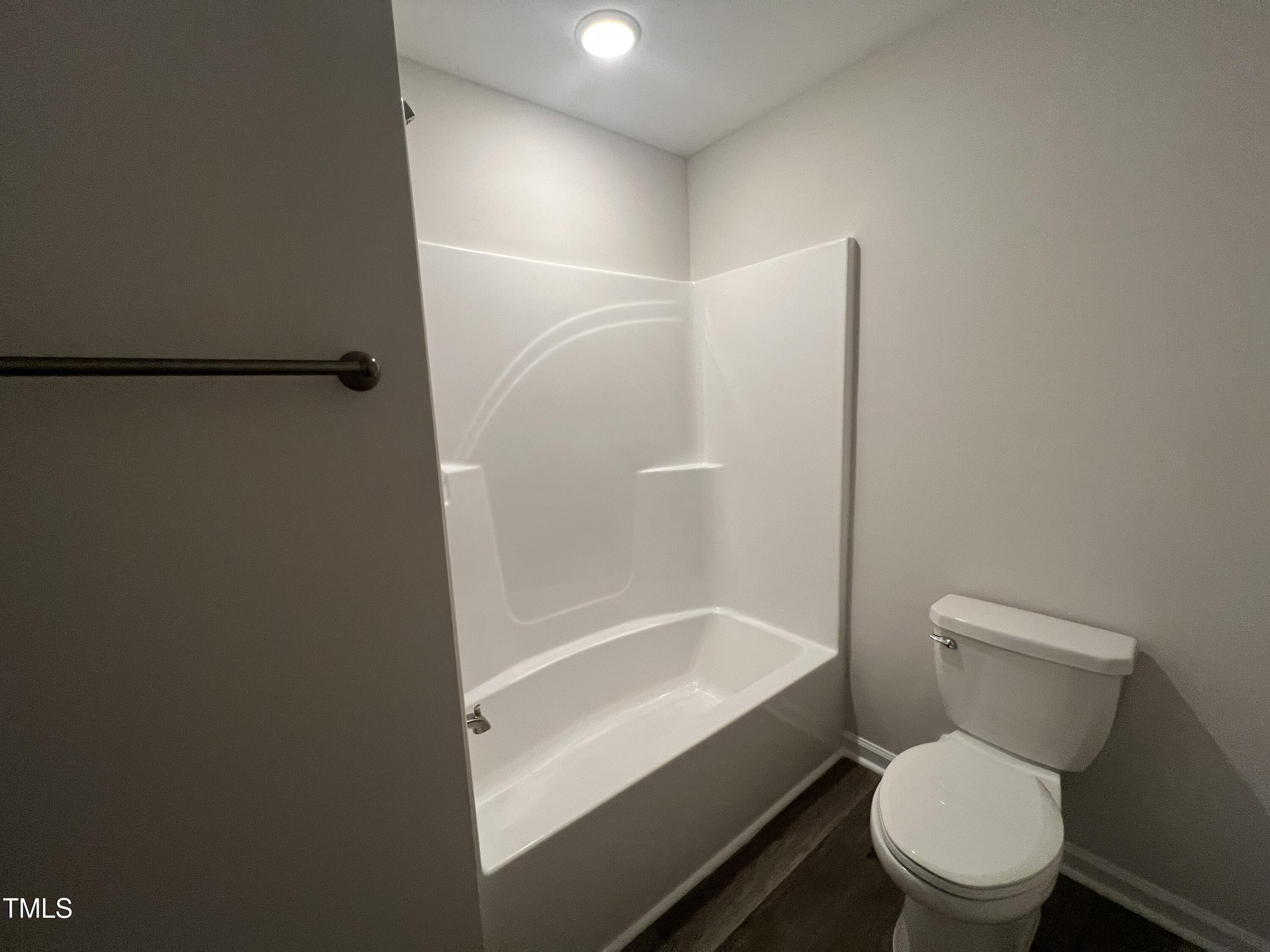 259 Palomo Place Raeford, NC 28376 - Photo 20 of 23 a white toilet sitting next to a bath tub