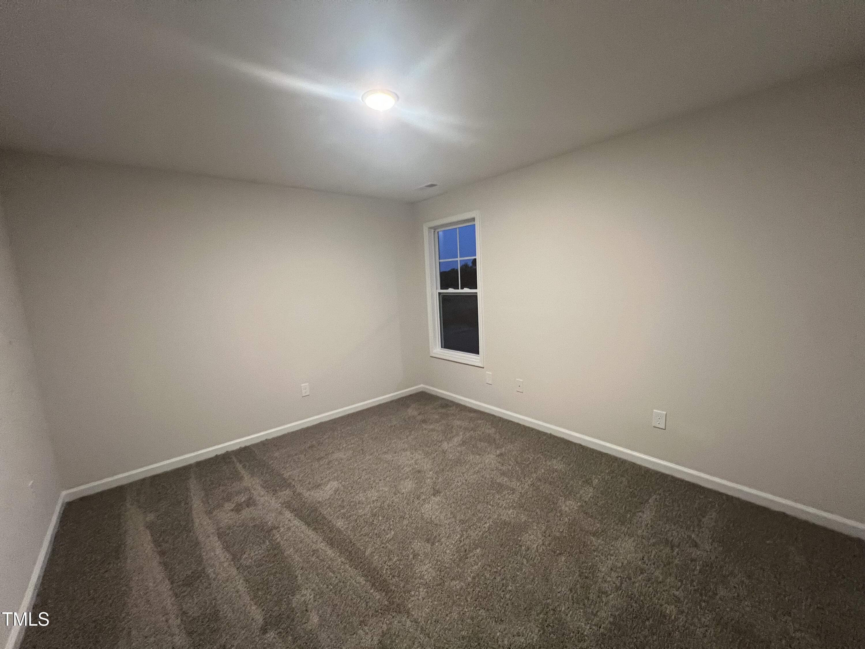 259 Palomo Place Raeford, NC 28376 - Photo 21 of 23 an empty room with a empty space and windows