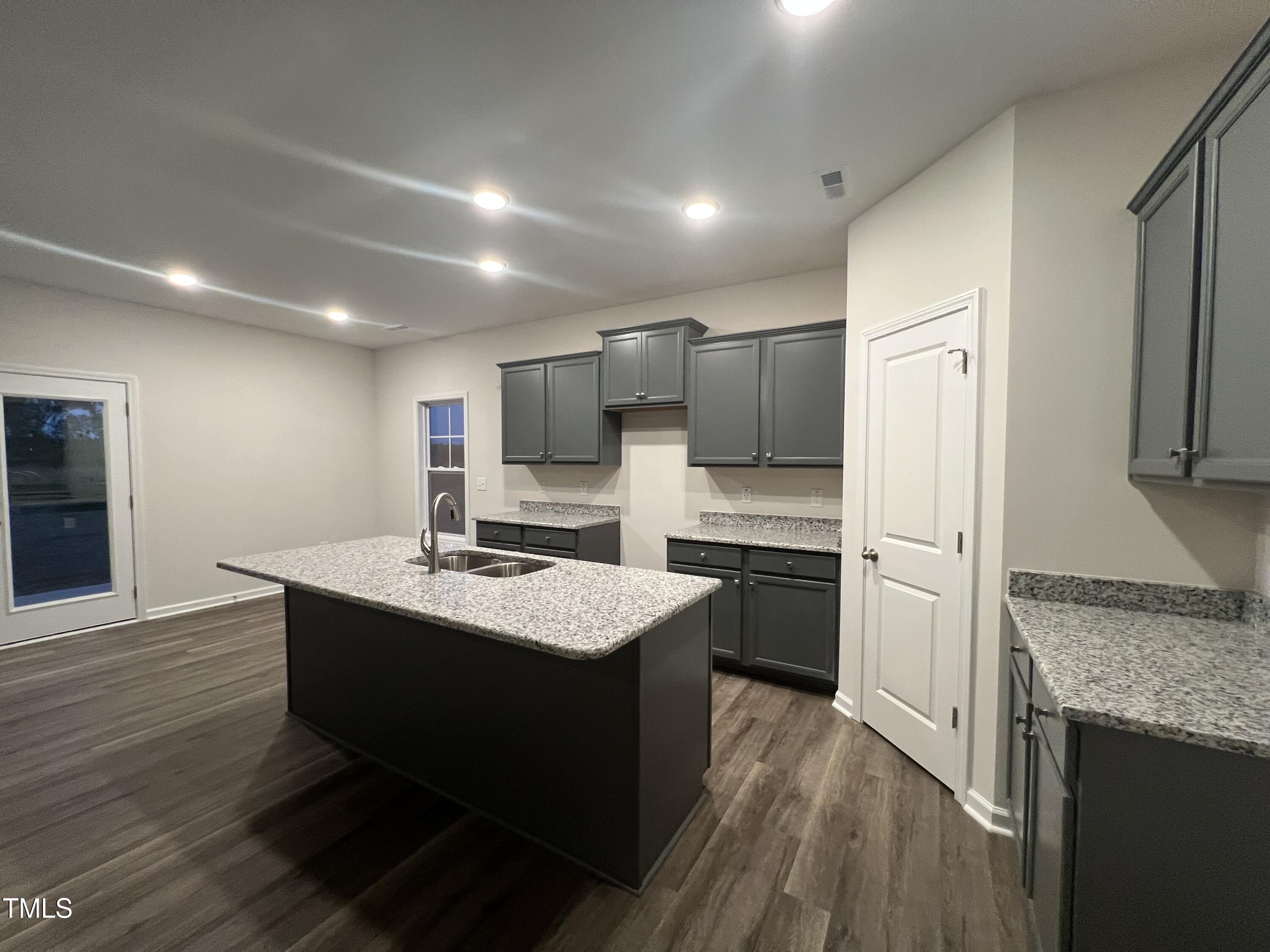 259 Palomo Place Raeford, NC 28376 - Photo 3 of 23 a kitchen with a sink stove and refrigerator