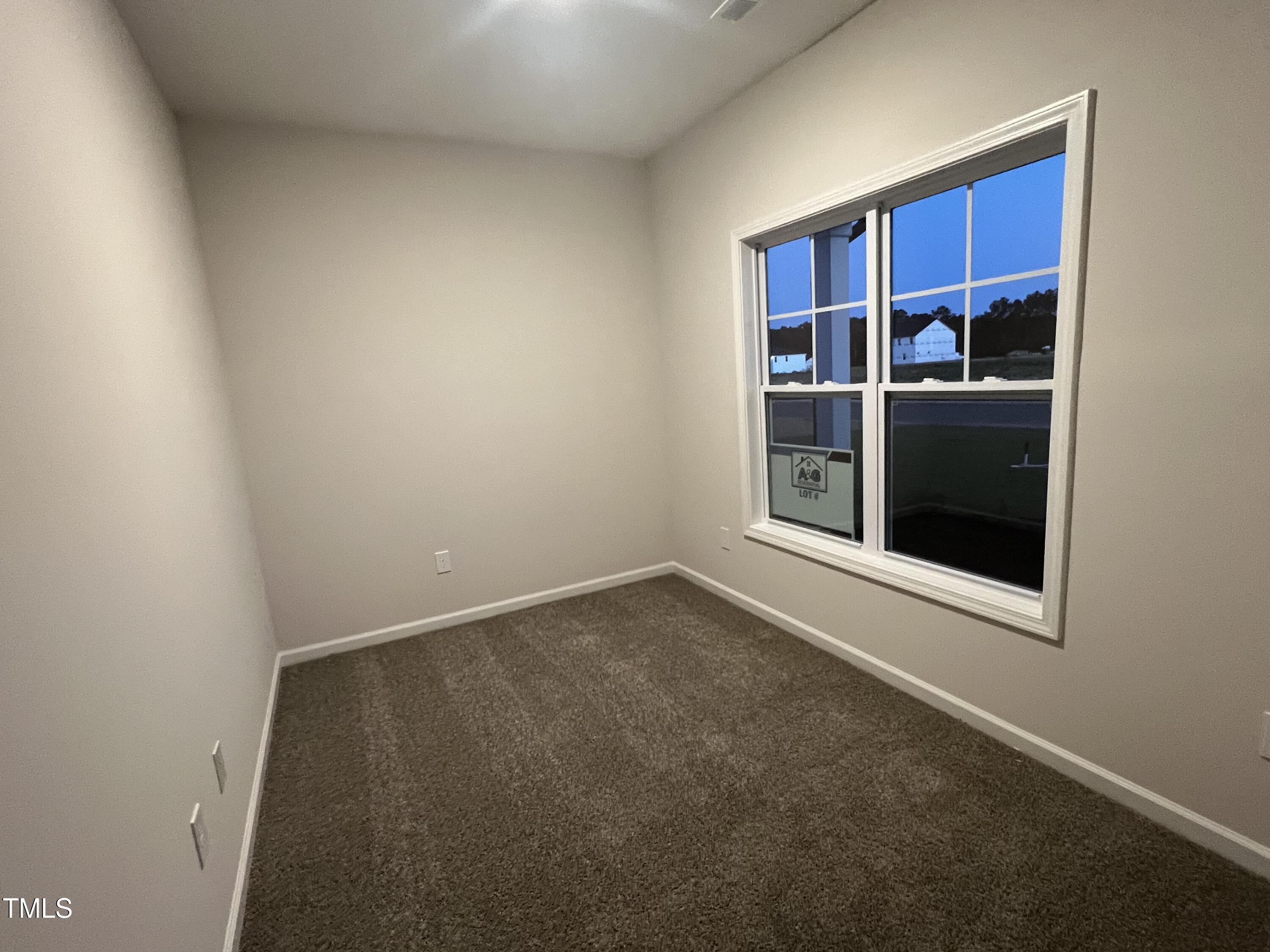 259 Palomo Place Raeford, NC 28376 - Photo 7 of 23 a view of an empty room with a fireplace and wooden shelves