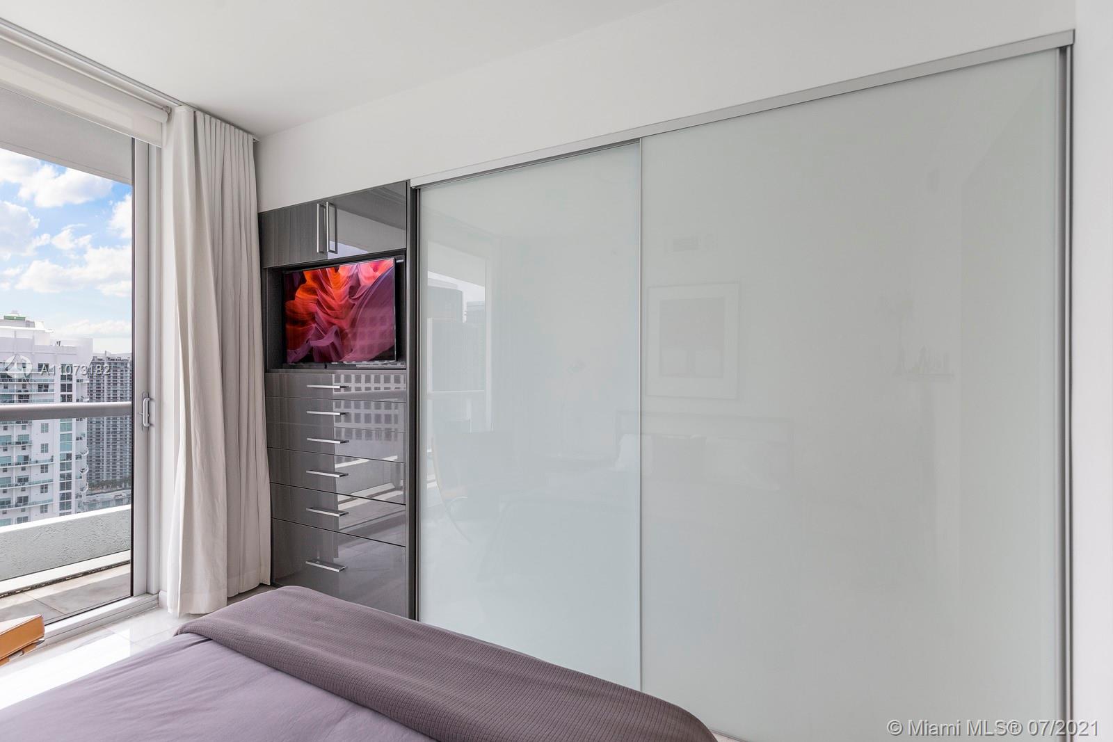 485 Brickell Avenue, Unit 4108 Miami, FL 33131 - Photo 16 of 21 a living room with furniture and a floor to ceiling window