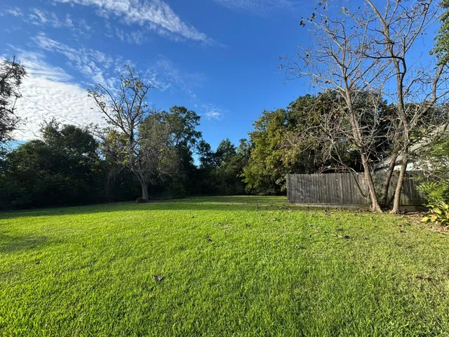 a backyard of a house with lots of green space