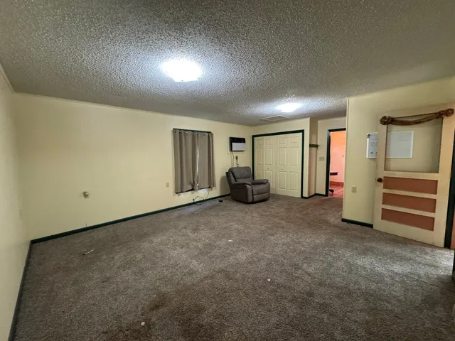 a view of an empty room and closet