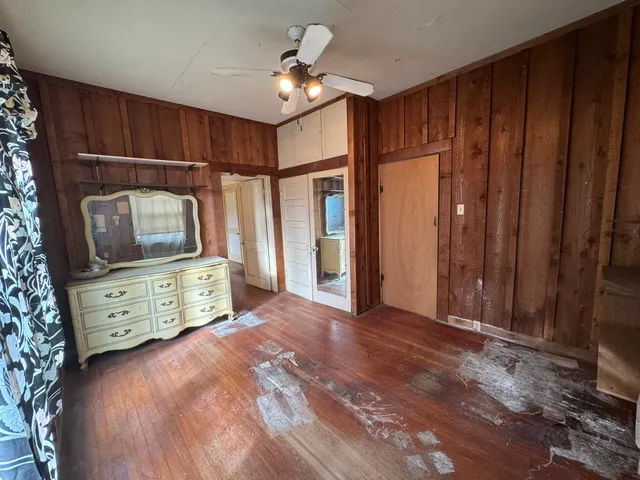 a bed room with a bed and a television